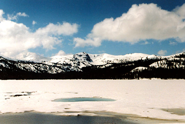 frozen lake and snowy mountains