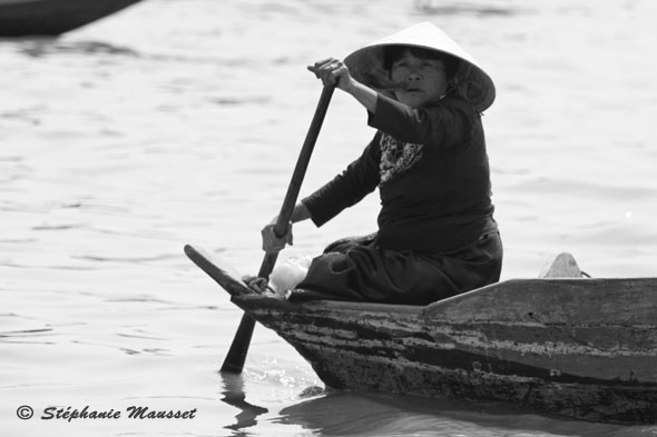 Cambodian woman on a dugout