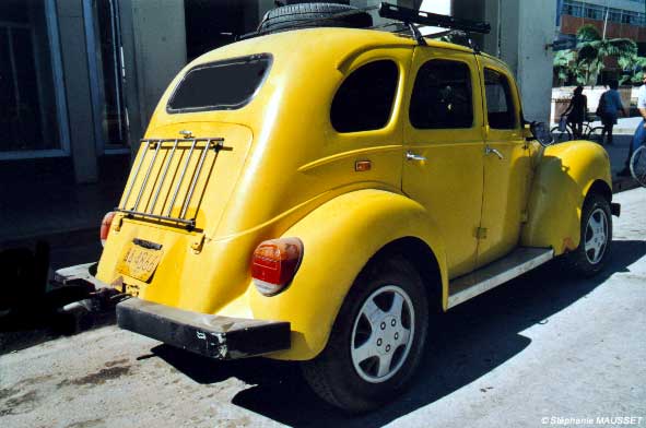 Yellow old american car of Cuba