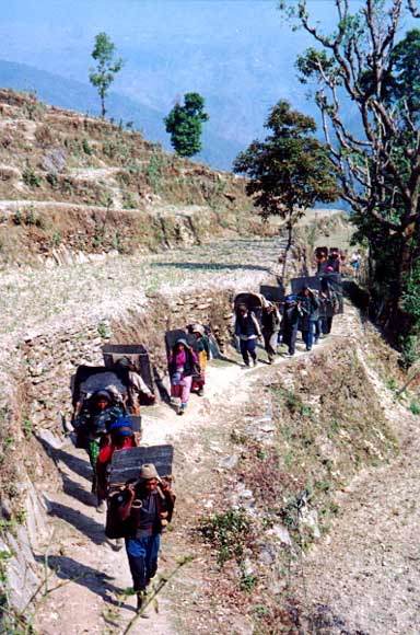 line of people carrying slate