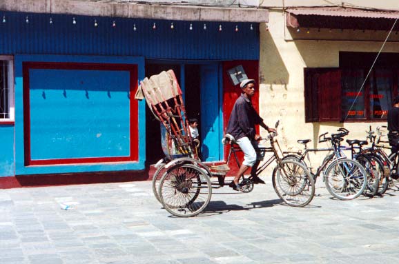 young nepali on a trishaw