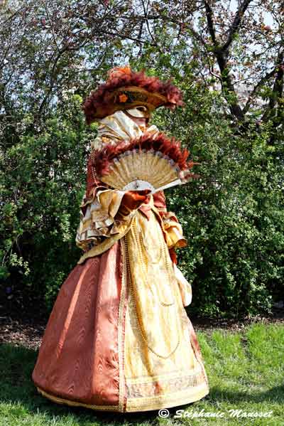 hat and fan at the venetian carnival in paris