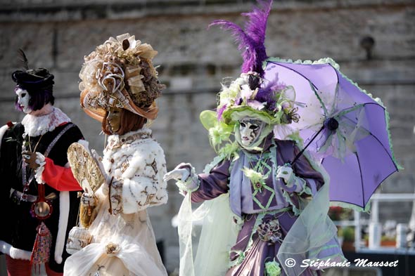 feathers and parasol at the venetian carnival in paris