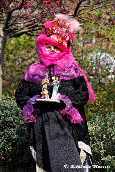 combined mask hat at the venetian carnival in paris