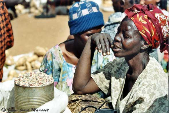 Zimbabwean woman basking in the sun in the market